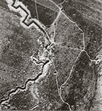 Over the German lines, showing deep trenches, mine craters and shell-pitted ground by English Photographer